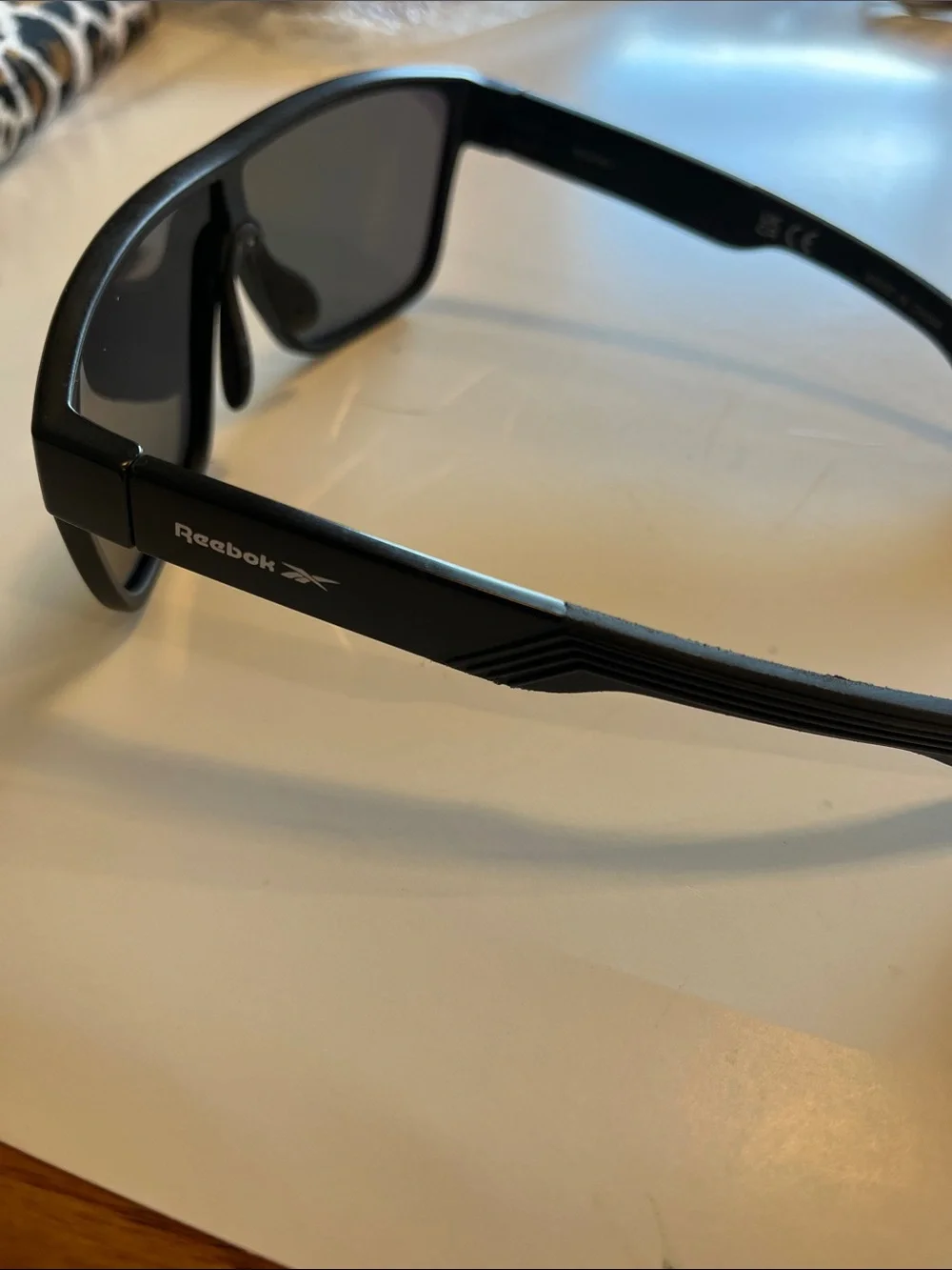 Reebok Black Frame Sunglasses with Red-Gold Mirrored Lens